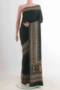 Bottle Green Mysore Crepe Saree with Printed design on the body and Printed Border displayed on a mannequin