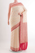 Off White Banarasi Georgette Saree with Zari Brocade on the body and Zari Border.  displayed on a mannequin