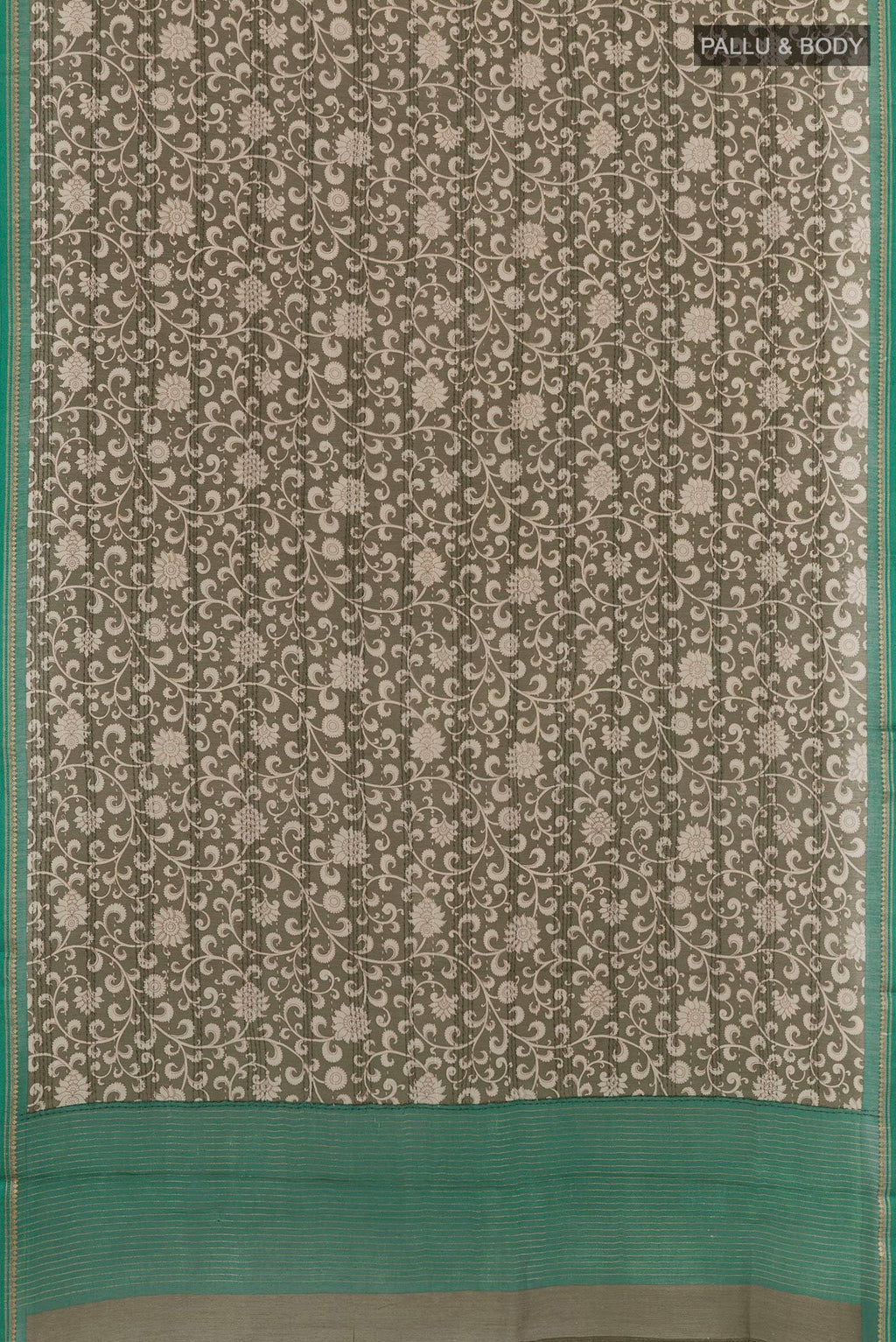 Flat view of Mehandi Green Tussar Saree with Printed design on the body and Zari Border. 