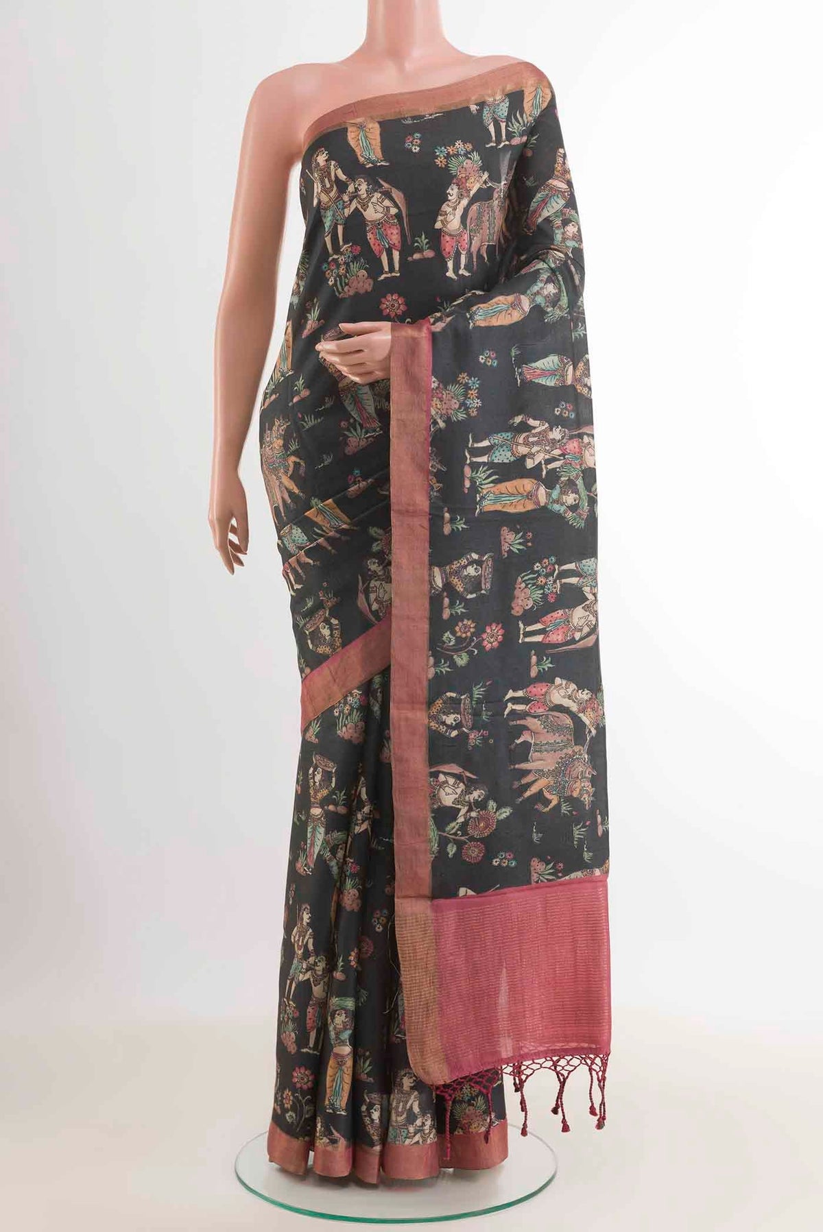 Black Tussar Saree with Printed design on the body and Zari Border displayed on a mannequin