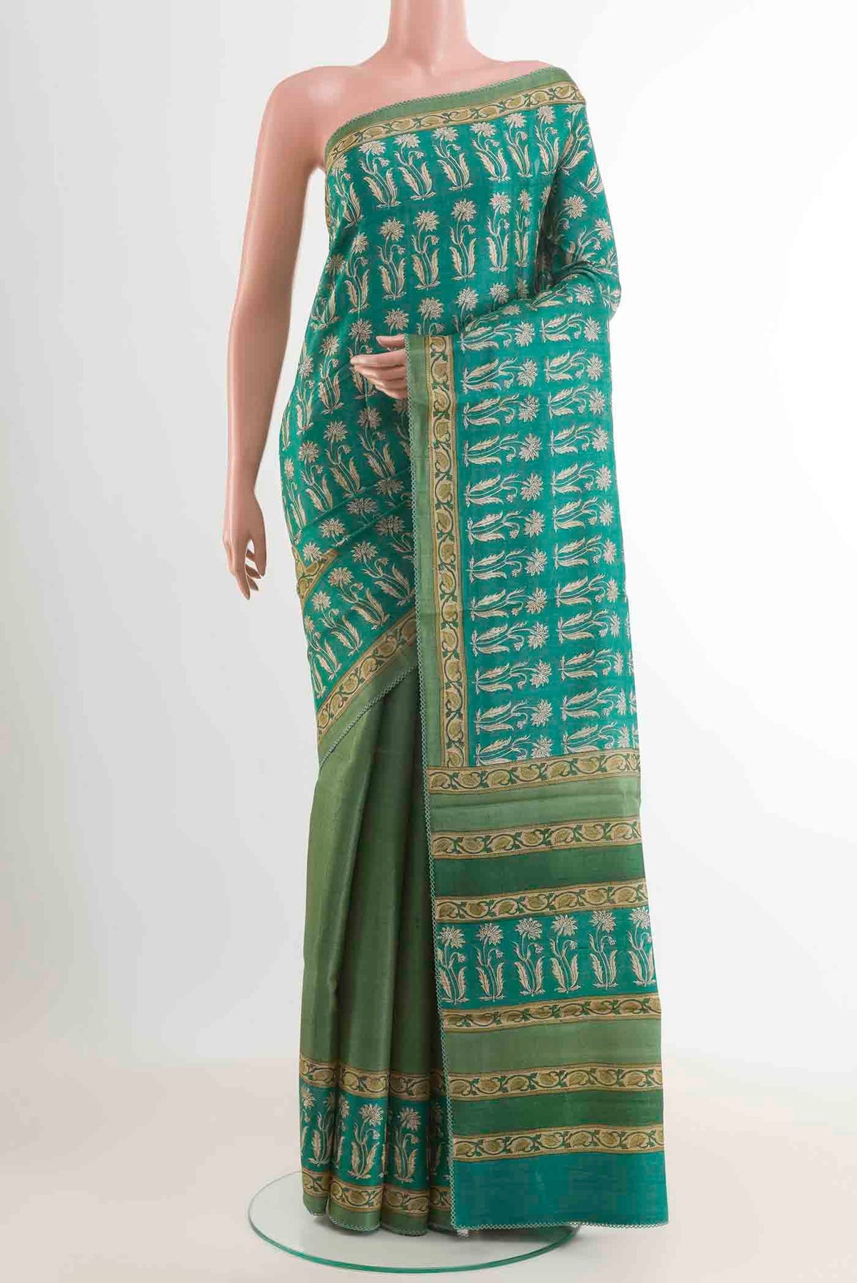 Green Tussar Saree with Plain Body and Printed Border displayed on a mannequin