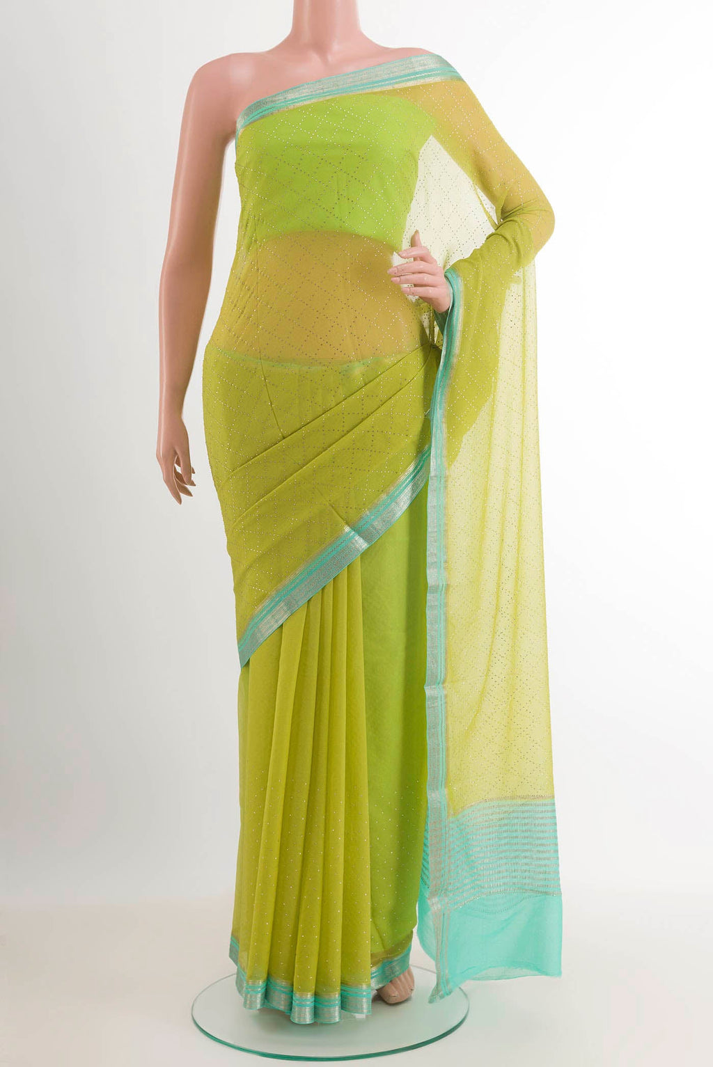 Green Mysore Chiffon Saree with Embroidery on the body and Zari Border.  displayed on a mannequin