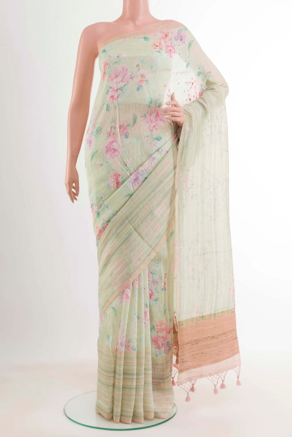 Yellow Linen Saree with Printed design on the body and Zari Border.  displayed on a mannequin