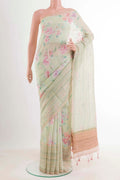 Yellow Linen Saree with Printed design on the body and Zari Border.  displayed on a mannequin