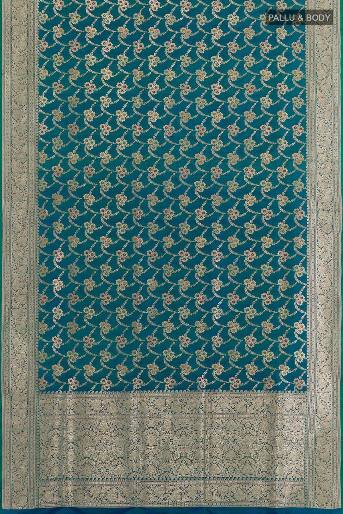 Flat view of Peacock Blue Banarasi Silk Saree with Zari Butta on the body and Zari Border. 