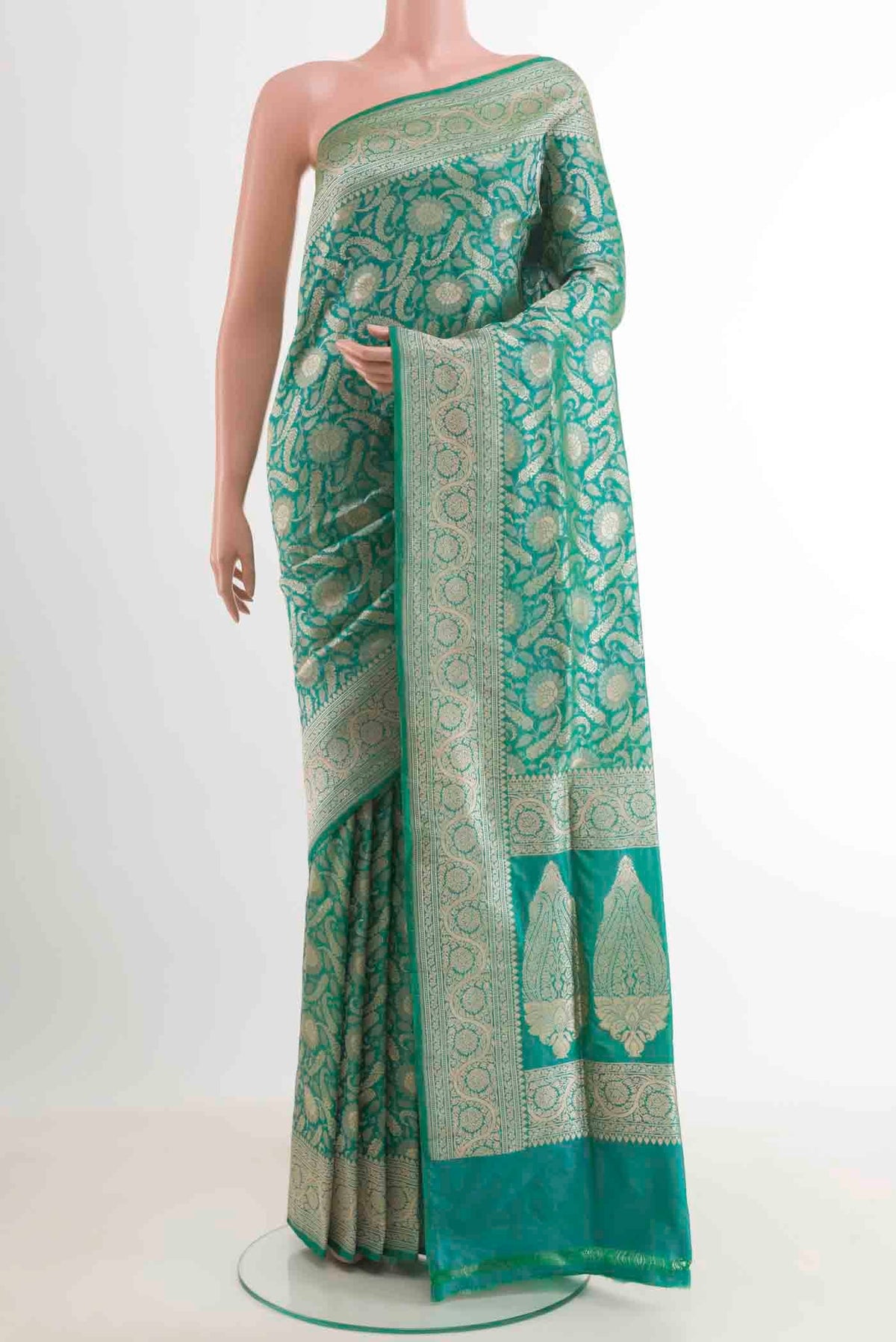 Sea Green Banarasi Silk Saree with Zari Brocade on the body and Zari Border.  displayed on a mannequin