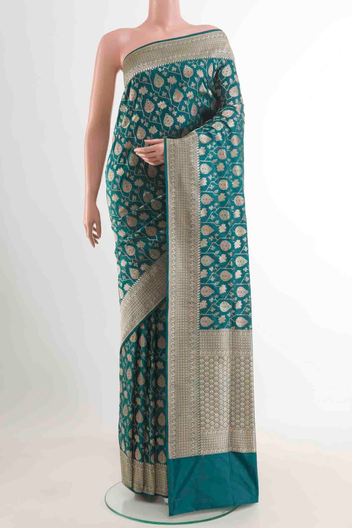 Teal Banarasi Silk Saree with Zari Brocade on the body and Zari Border.  displayed on a mannequin
