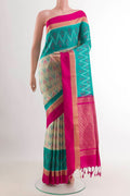 Cream Soft Silk Saree with Ikat design on the body and Zari Border.  displayed on a mannequin