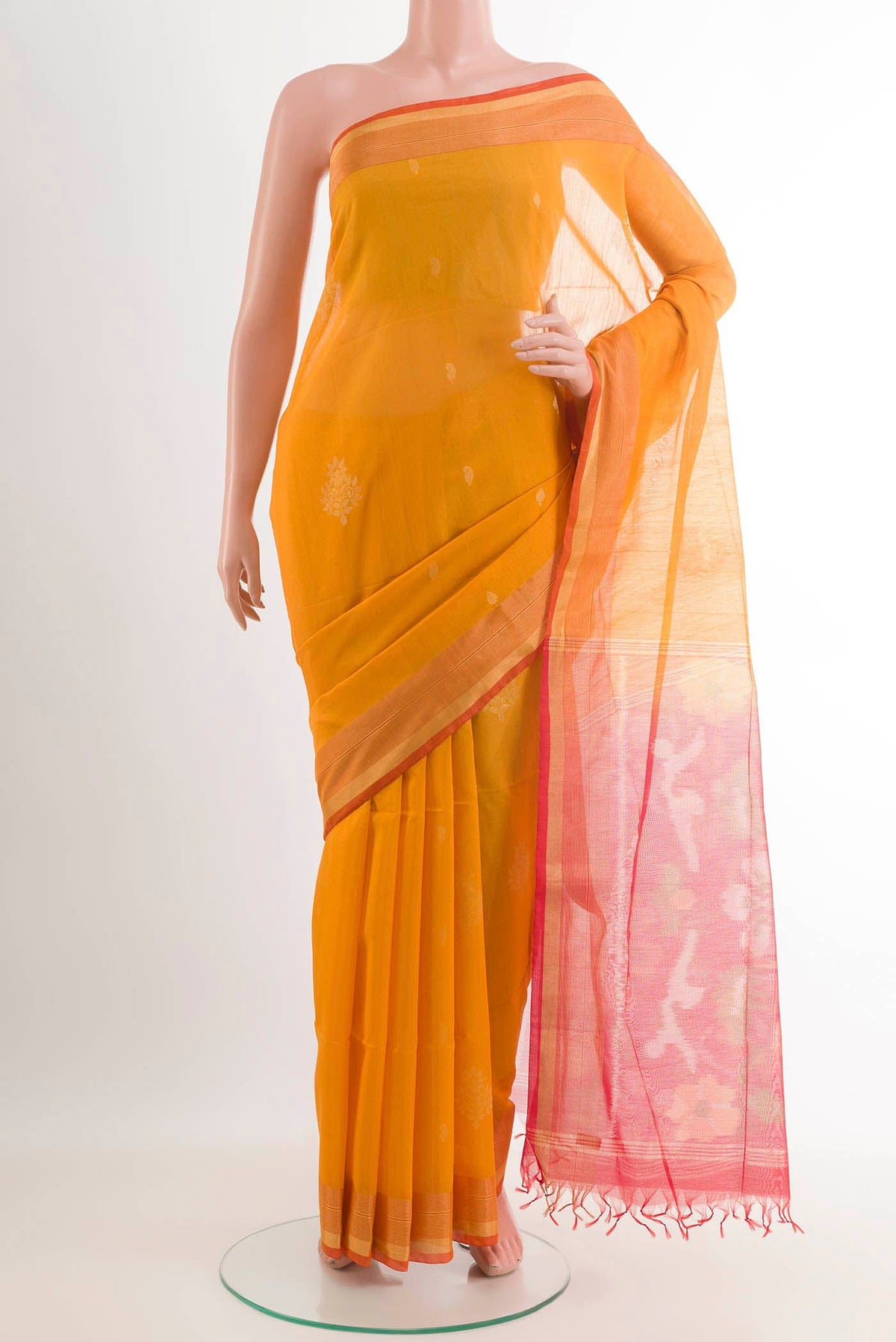 Mustard Blended Kota Cotton Saree with Zari Butta on the body and Zari Border.  displayed on a mannequin