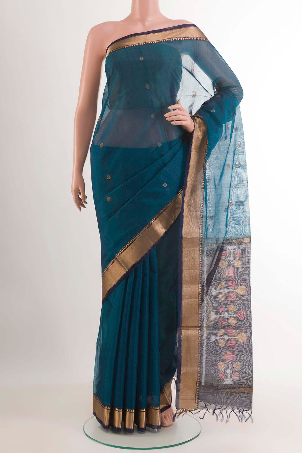 Blue Blended Chanderi Kora Silk Saree with Zari And Thread Butta on the body and Zari Border.  displayed on a mannequin