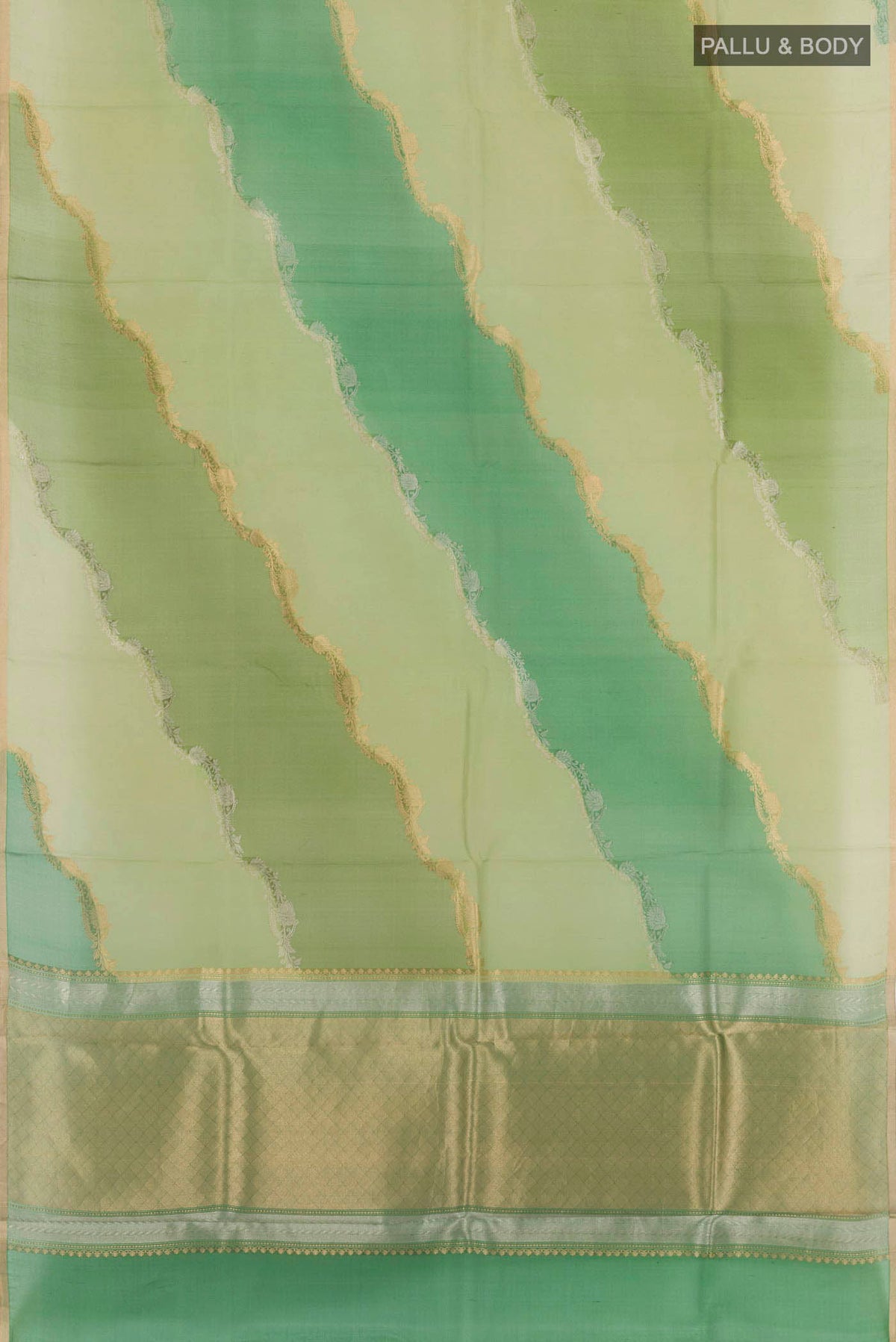 Flat view of Green Banarasi Kora Silk Saree with Zari Butta on the body and Zari Border. 