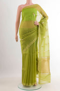 Green Banarasi Kora Silk Saree with Zari Butta on the body and Zari Border.  displayed on a mannequin