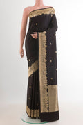 Black Banarasi Silk Saree with Zari Butta on the body and Zari Border.  displayed on a mannequin