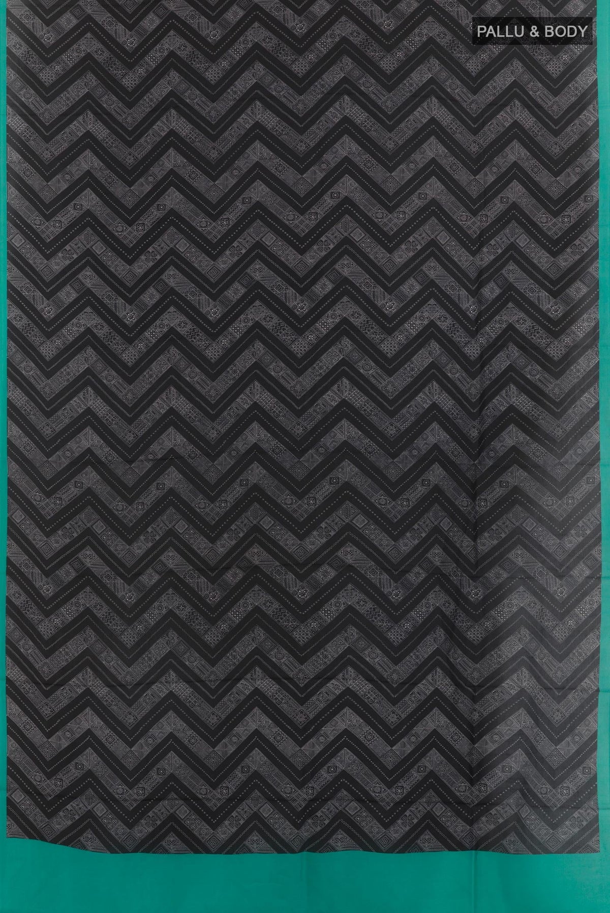 Flat view of Black Printed Silk Saree with Printed design on the body and Printed Border. 