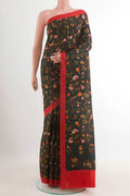 Black Printed Silk Saree with Printed design on the body and Plain Border.  displayed on a mannequin
