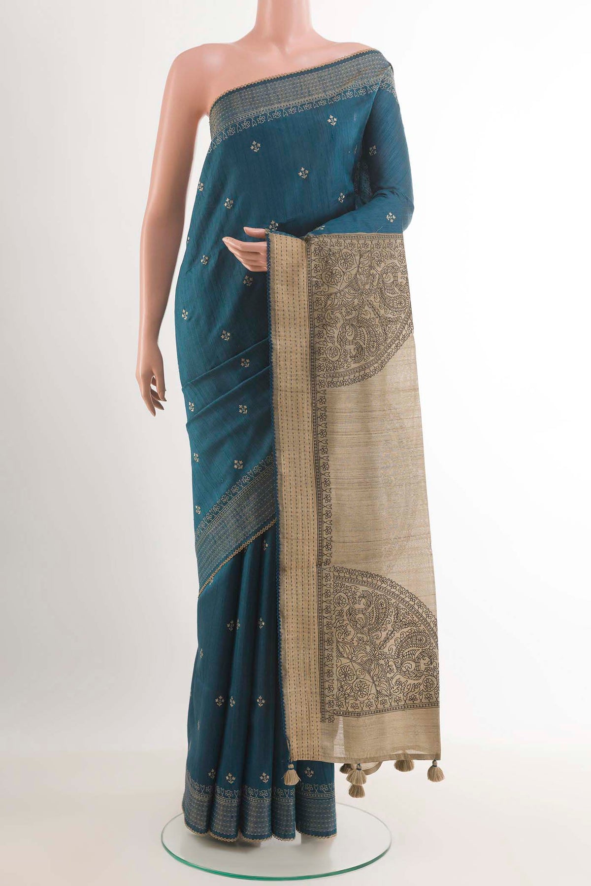 Blue Tussar Saree with Thread Butta on the body and Temple Border.  displayed on a mannequin