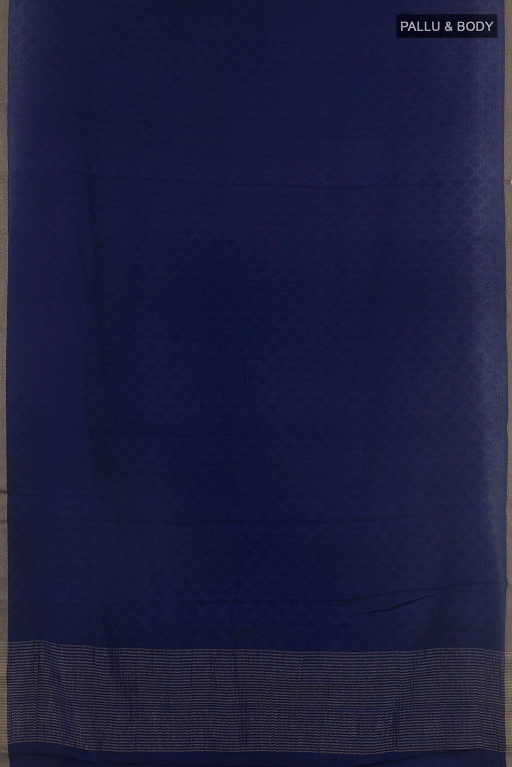 Flat view of Dark Blue Mysore Crepe Saree with Jacquard design on the body and Zari Border. 