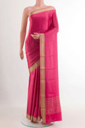 Pink Mysore Crepe Saree with Plain Body and Zari Border.  displayed on a mannequin
