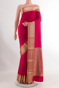Pink Mysore Crepe Saree with Plain Body and Zari Border.  displayed on a mannequin