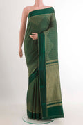 Bottle Green Mysore Crepe Saree with Stripes on the body and Zari Border.  displayed on a mannequin