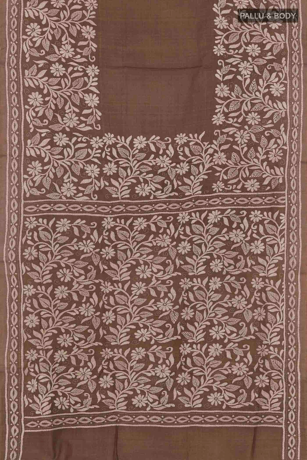 Flat view of Brown Tussar Saree with Kantha Work on the body and Embroidery Border. 