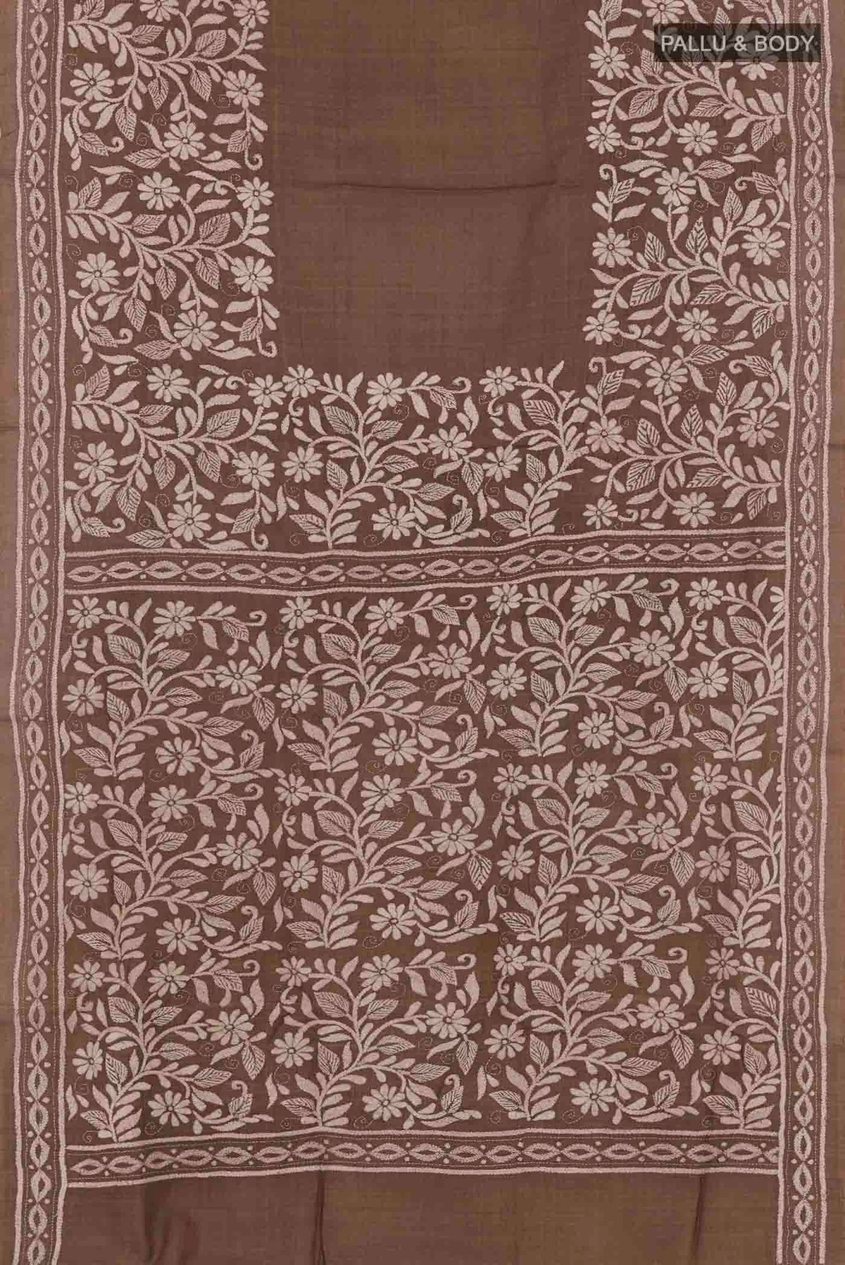 Flat view of Brown Tussar Saree with Kantha Work on the body and Embroidery Border. 