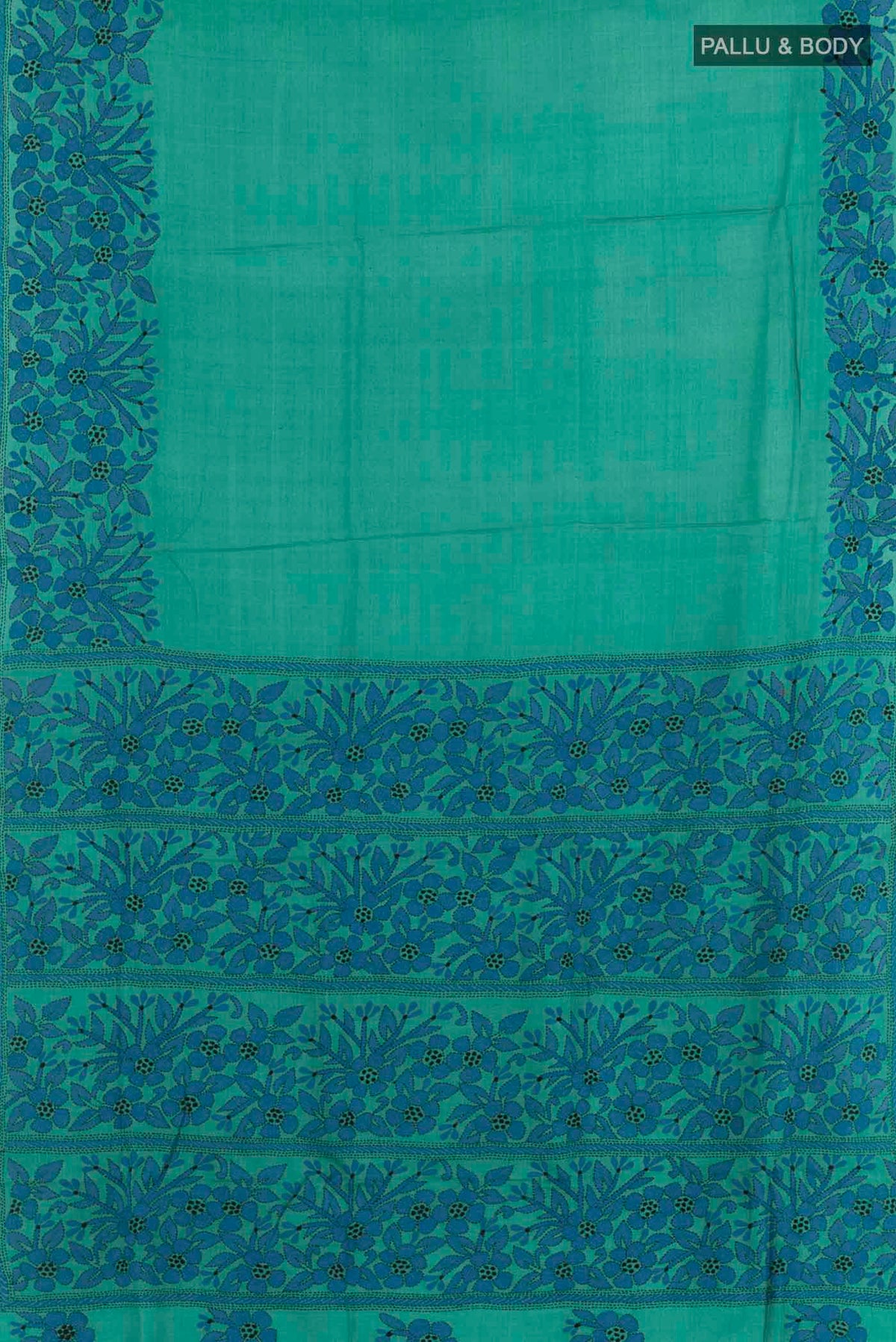 Flat view of Blue Tussar Saree with Kantha Work on the body and Embroidery Border. 