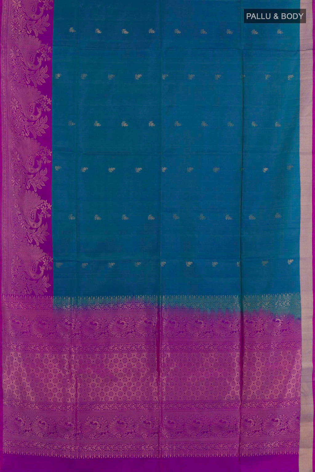 Flat view of Peacock Blue Soft Silk Saree with Zari Butta on the body and Zari Border. 