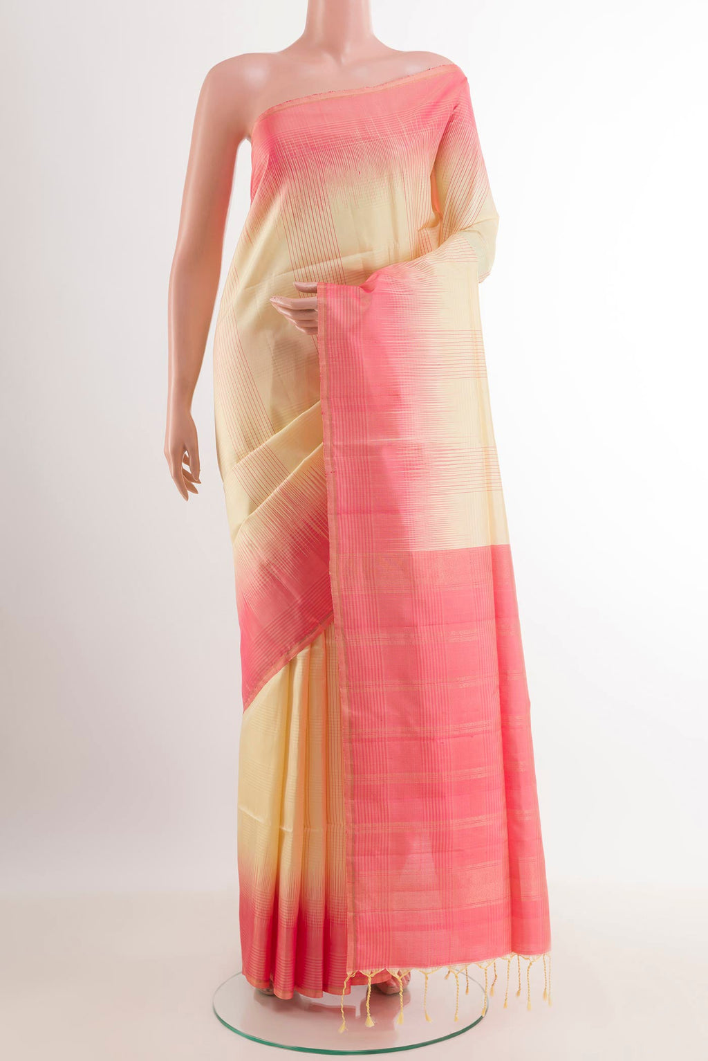 Lemon Yellow Soft Silk Saree with Checked design on the body and Zari Border.  displayed on a mannequin