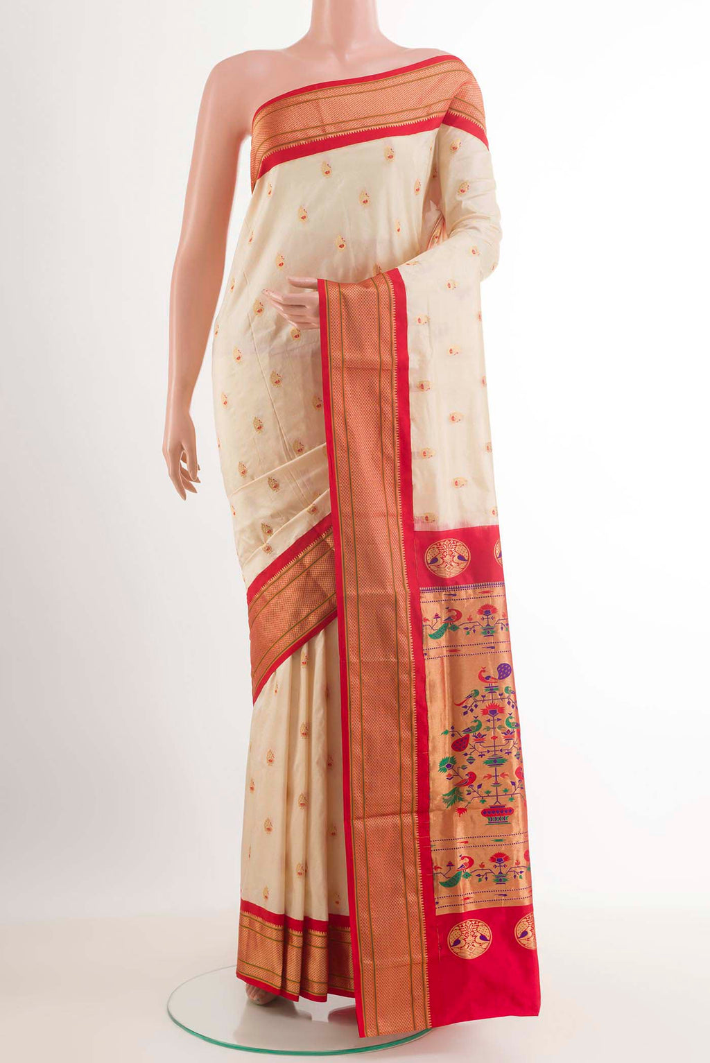 Off White Soft Silk Saree with Zari Butta on the body and Zari Border.  displayed on a mannequin