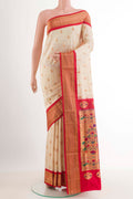 Off White Soft Silk Saree with Zari Butta on the body and Zari Border.  displayed on a mannequin