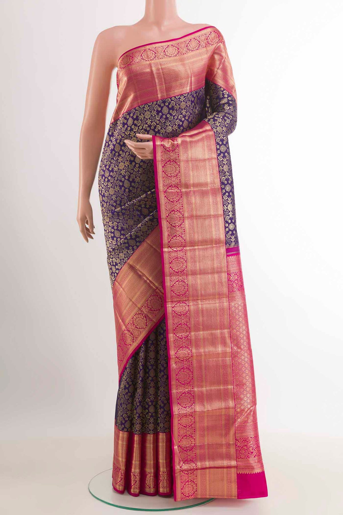 Dark Blue Kanchipuram Silk Saree with Zari Brocade on the body and Zari Border.  displayed on a mannequin