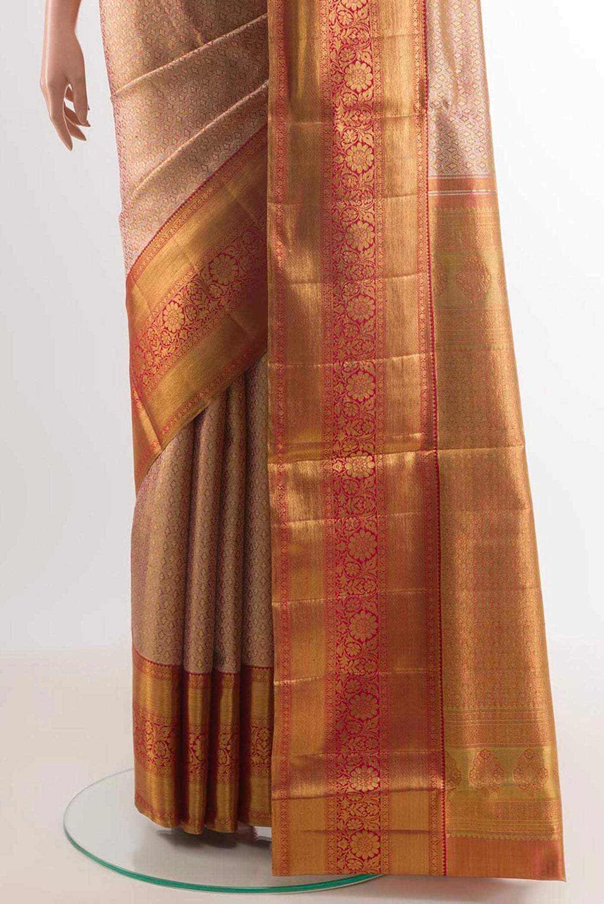 Pleats and pallu of Golden Peach Kanjivaram Silk Saree with Zari Brocade on the body and Zari Border. 