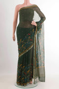 Green Mysore Chiffon Saree with Printed design on the body and Zari Border.  displayed on a mannequin