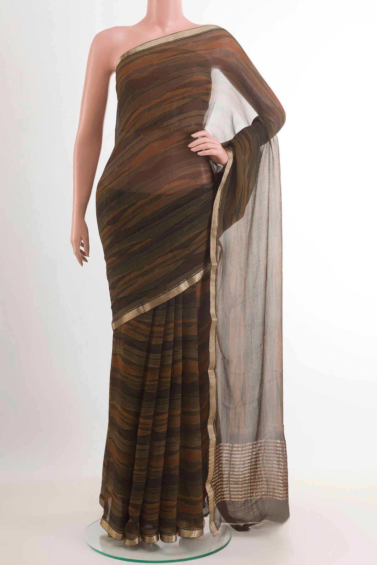 Green Mysore Chiffon Saree with Printed design on the body and Zari Border.  displayed on a mannequin