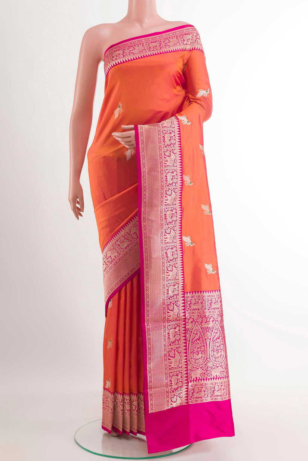 Orange Banarasi Silk Saree with Zari Butta on the body and Zari Border.  displayed on a mannequin