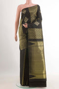 Black Kanchipuram Silk Saree with Zari Butta on the body and Zari Border.  displayed on a mannequin