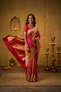 Model wearing a Multi Color Banarasi Silk Saree with Zari Brocade on the body and Zari Border.