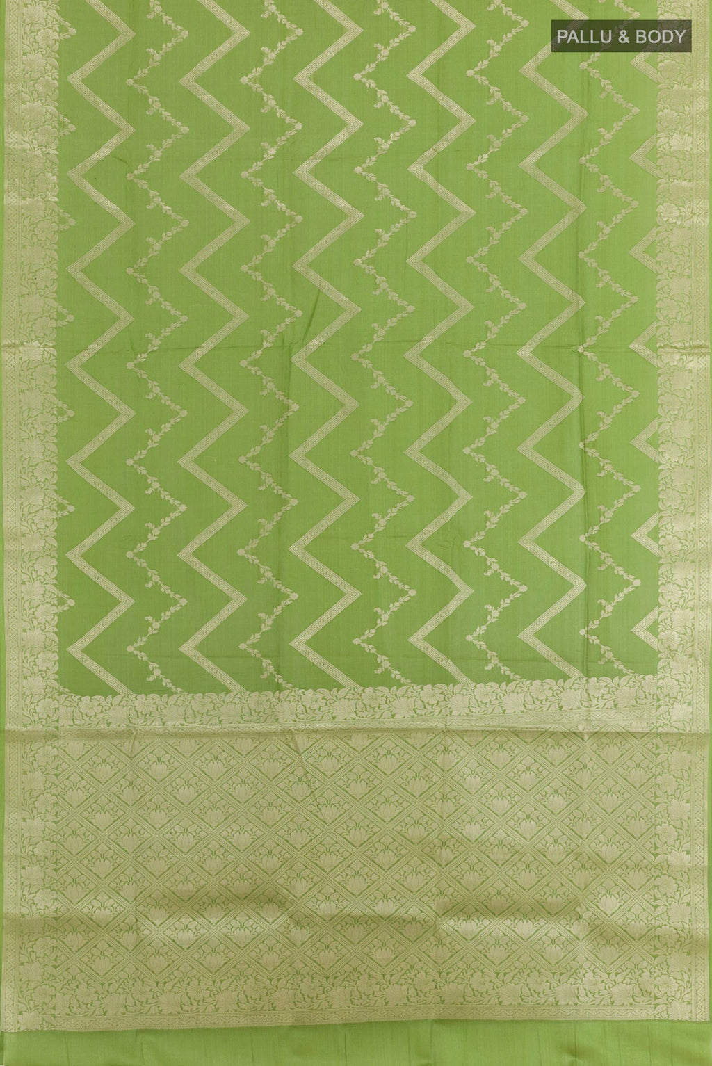 Flat view of Green Tussar Silk Saree with Zari Brocade on the body and Zari Border. 