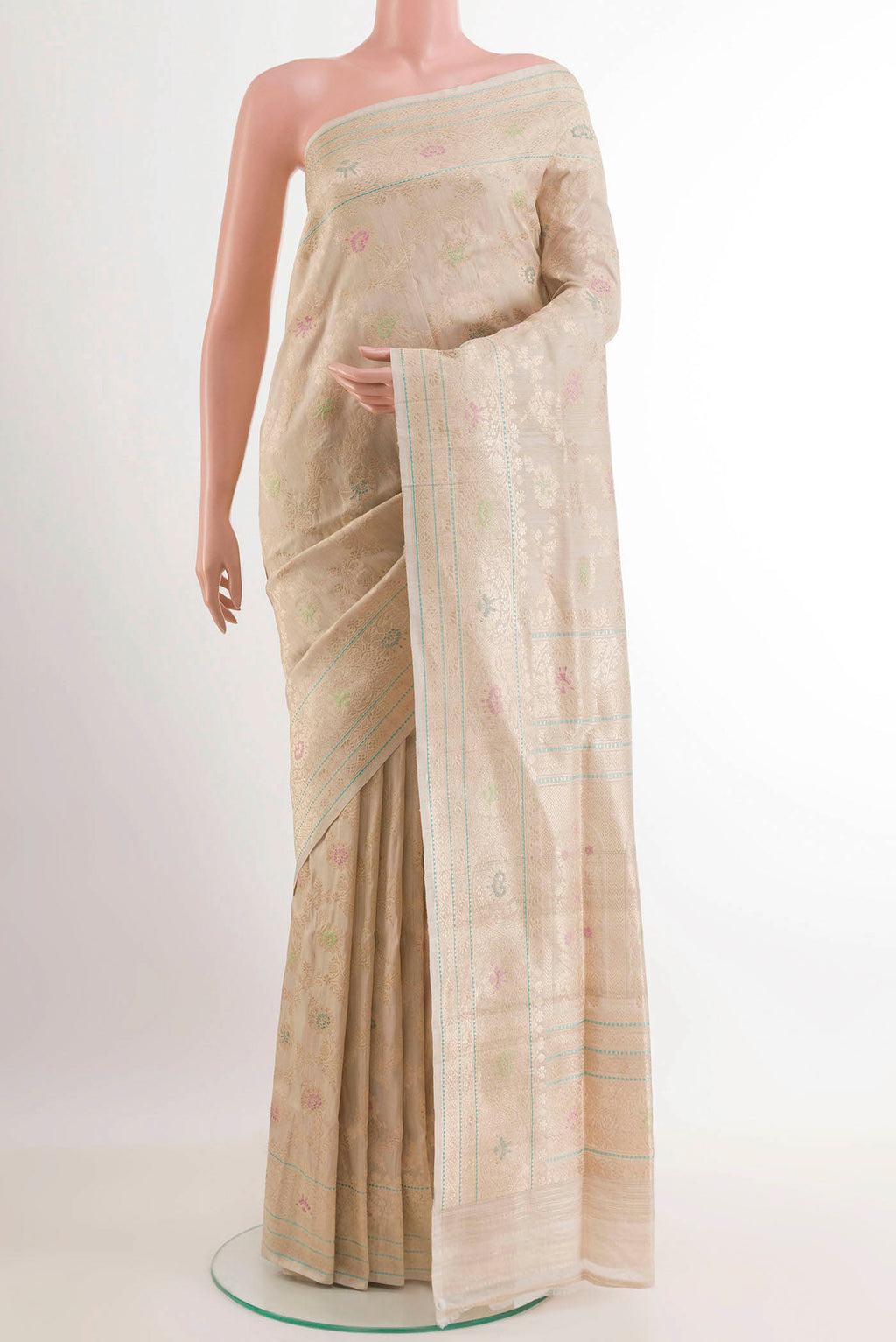 Off White Banarasi Tussar Silk Saree with Zari Butta on the body and Zari Border.  displayed on a mannequin