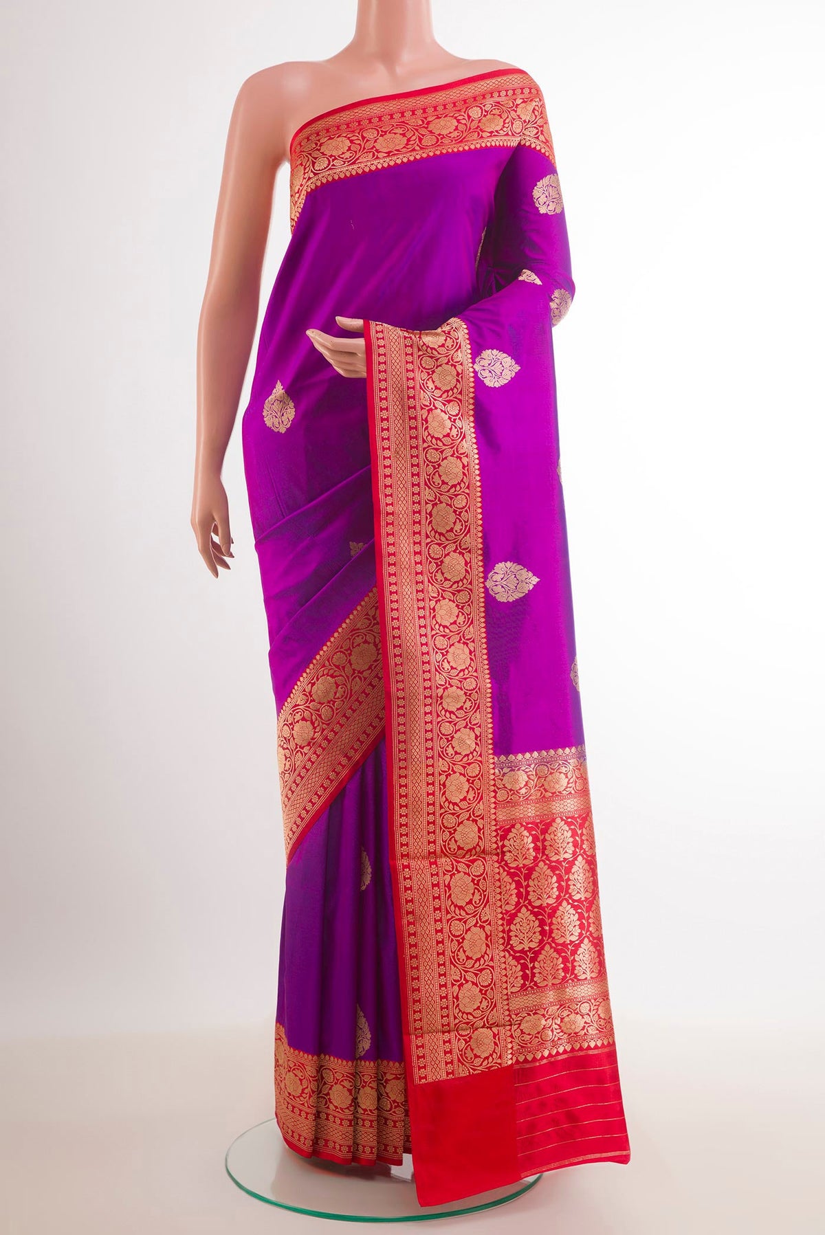 Purple Banarasi Katan Silk Saree with Zari Butta on the body and Zari Border.  displayed on a mannequin