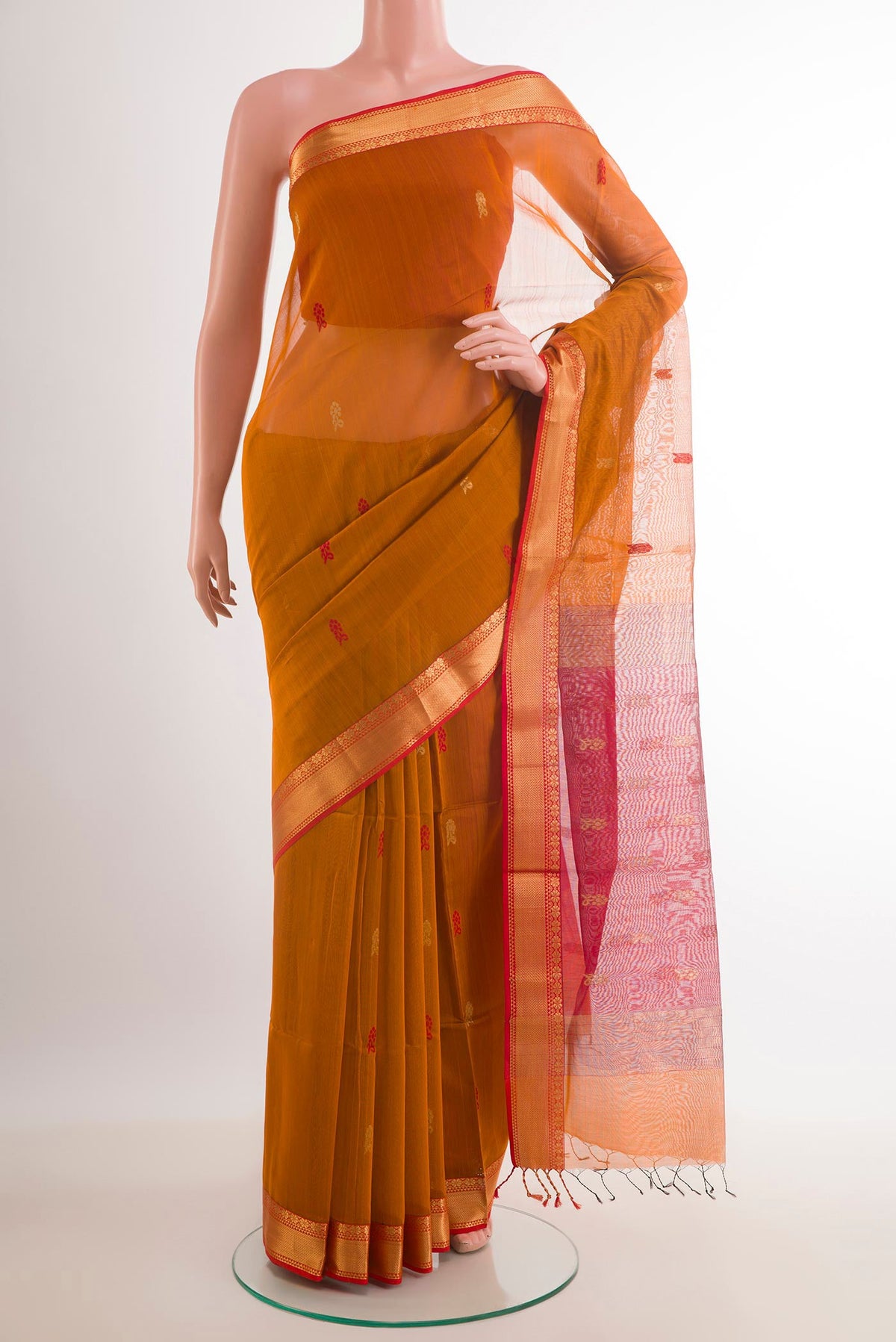 Mustard Blended Kora Cotton Saree with Zari Butta on the body and Zari Border.  displayed on a mannequin