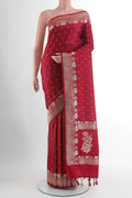 Maroon Blended Art Silk Saree with Zari Butta on the body and Zari Border.  displayed on a mannequin