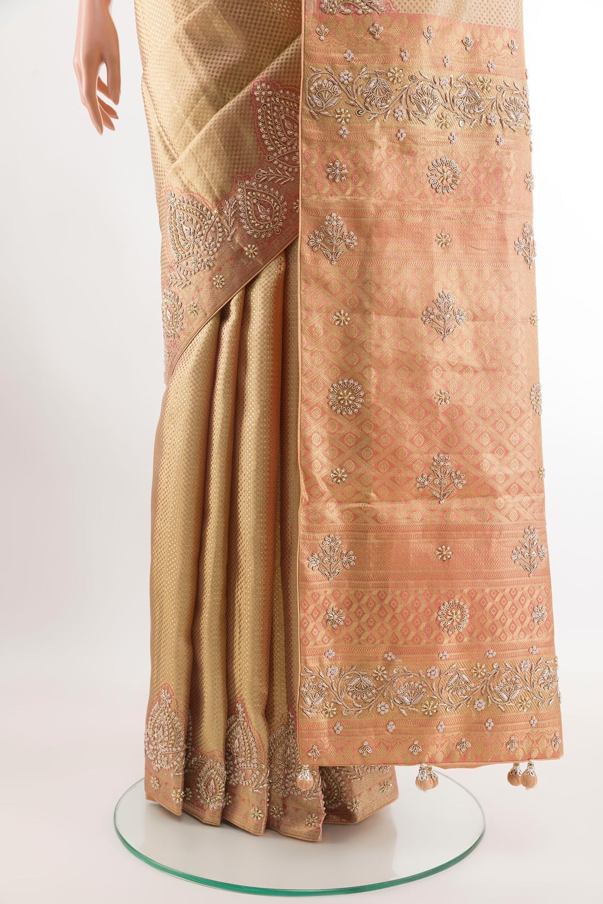 Pleats and pallu of Golden Tissue Silk Saree with Zari Brocade on the body and Embroidery Border. 