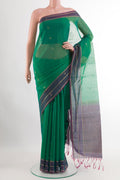 Green Blended Kora Cotton Saree with Zari Butta on the body and Zari Border.  displayed on a mannequin