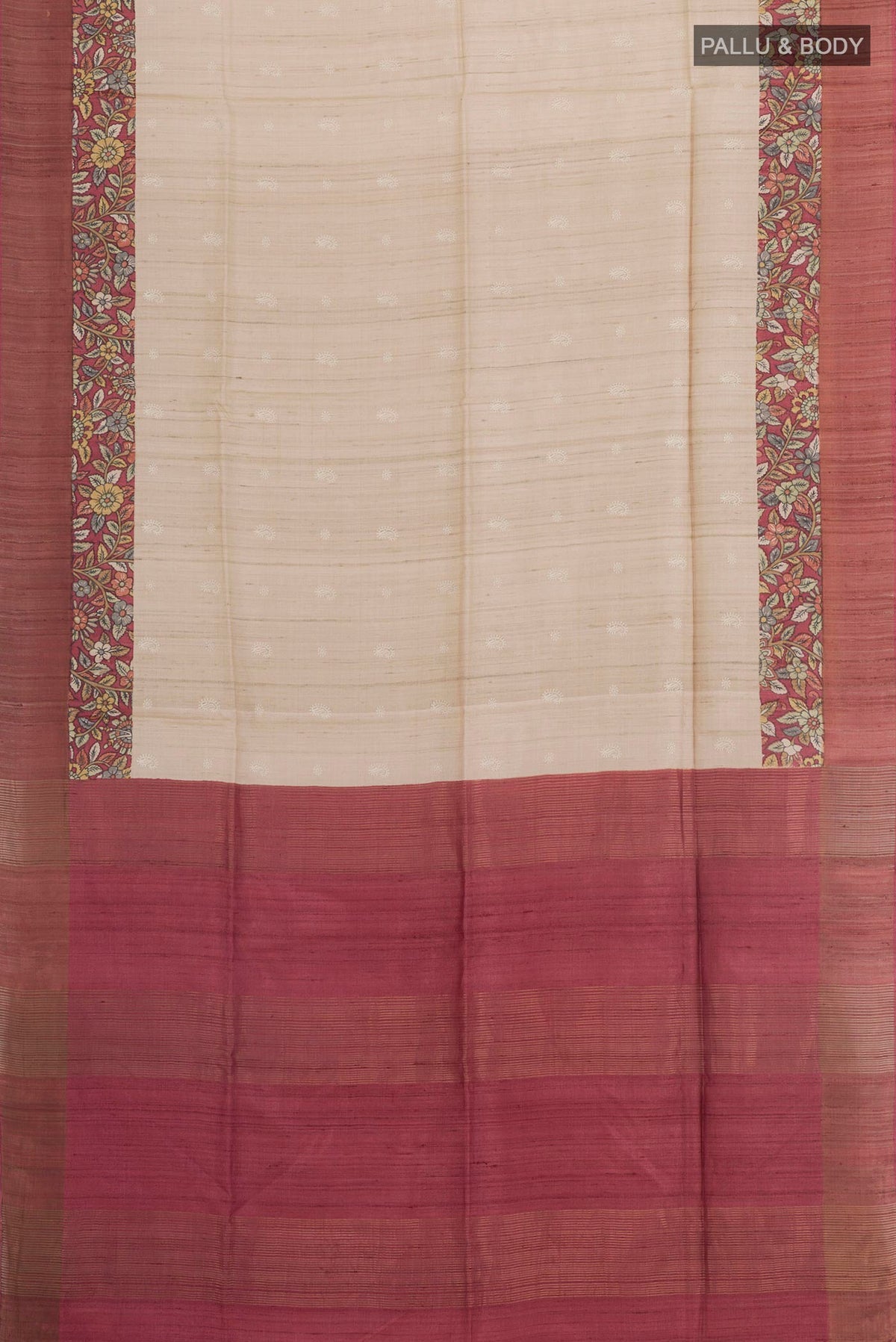 Flat view of Cream Tussar Saree with Thread Butta on the body and Zari Border. 