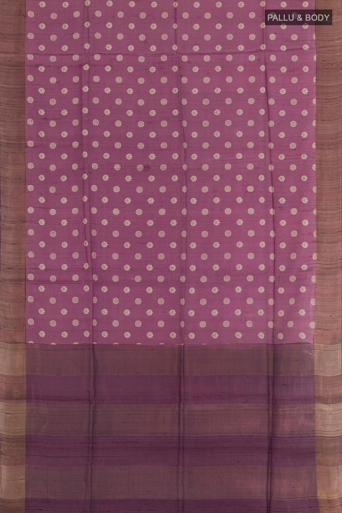 Flat view of Purple Tussar Saree with Printed design on the body and Zari Border. 
