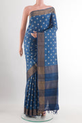 Blue Tussar Saree with Printed design on the body and Zari Border.  displayed on a mannequin