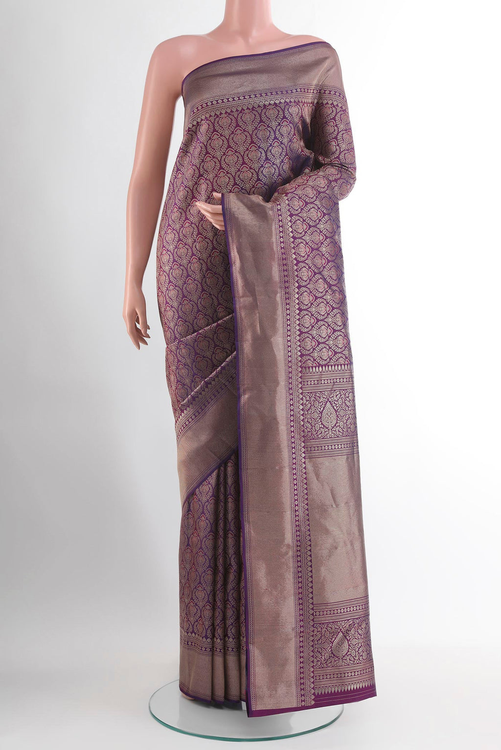 Purple Kanchipuram Silk Saree with Zari Butta on the body and Zari Border.  displayed on a mannequin