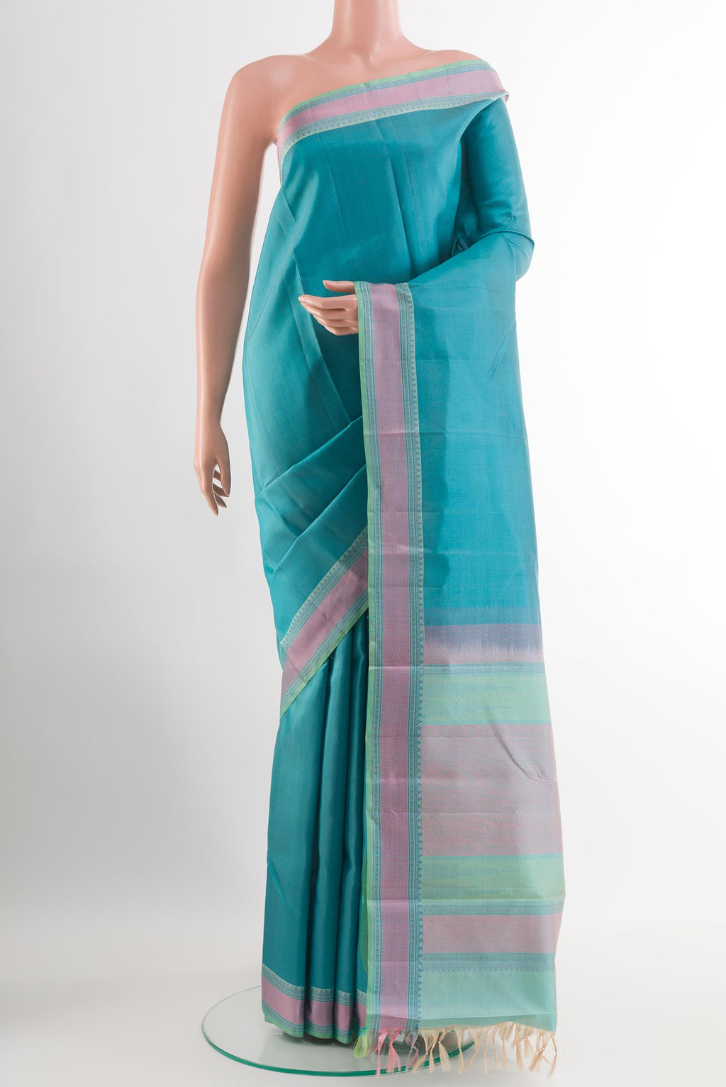 Blue Kanchipuram Silk Saree with Plain Body and Thread Embroidery Border.  displayed on a mannequin